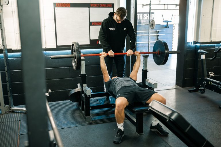 Strength coach Hampshire training client for powerlifting competition