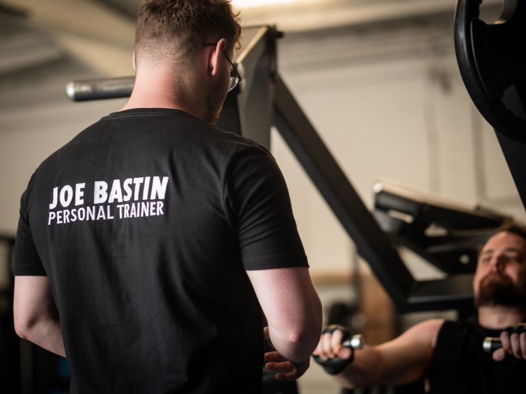 Strength coach Basingstoke working with male client to get stronger and fitter